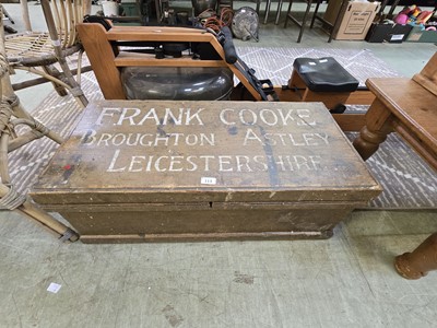 Lot 113 - A stained pine travelling trunk with top...