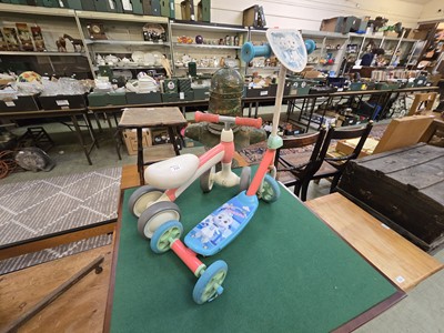 Lot 115 - A PVC child's ride on toy along with...