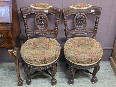Lot 47 - Pair of ornate carved oak framed chairs with...