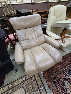 Lot 129 - A mushroom leather upholstered Ekornes...
