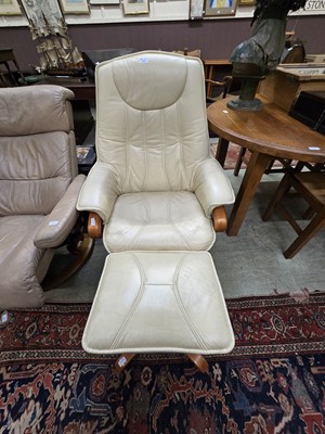 Lot 131 - A cream leather upholstered mid-20th century...