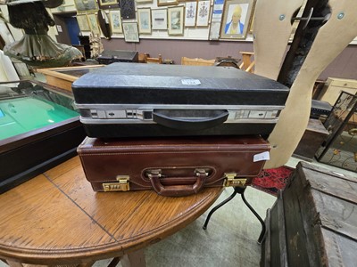 Lot 134 - A tan leather attaché style case along with...