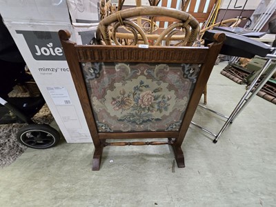 Lot 145 - An oak framed glazed fire screen with floral...