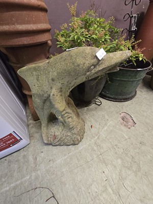 Lot 162 - A composite stone garden ornament in the form...