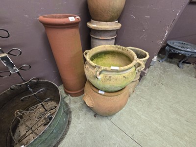 Lot 165 - A terracotta chimney pot along with terracotta...