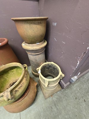 Lot 167 - A terracotta chimney pot along with shorter...