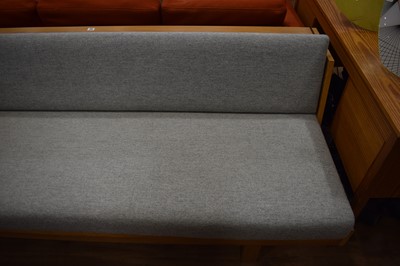 Lot 20 - A Danish oak and upholstered sofabed by...
