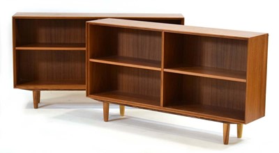 Lot 24 - A pair of Danish teak open bookcases, on later...