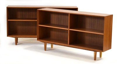 Lot 24 - A pair of Danish teak open bookcases, on later...