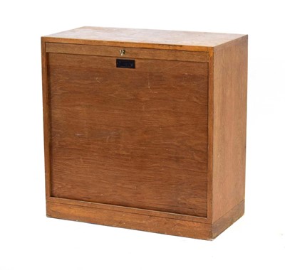 Lot 124 - A Danish oak tambour cabinet on a plinth base